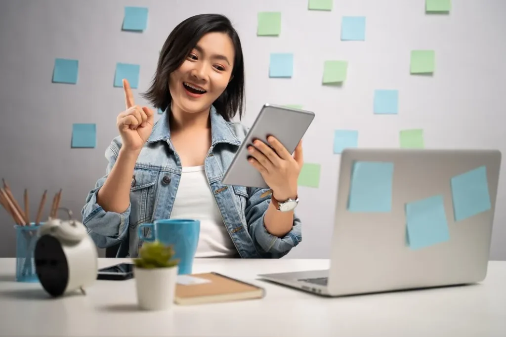 imgi 1 young woman using phone while sitting table 1048944 23568112 Vetencode